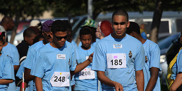 A group of children walking during the Long Cane Rally
